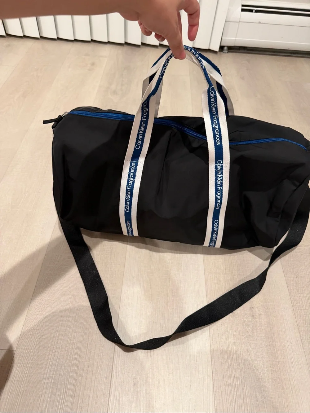 Calvin Klein Black Duffel with White-and-Blue Branded Handles